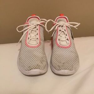 White and pink Nike shoes